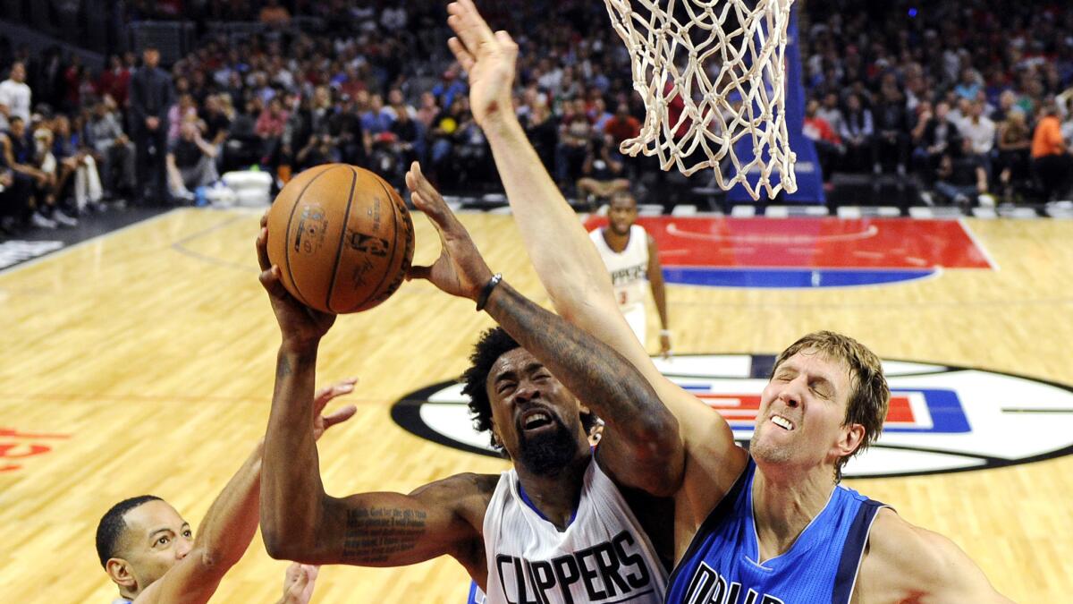 Clippers center DeAndre Jordan, getting fouled by Mavericks forward Dirk Nowitzki during a game Oct. 29, will be getting plenty of verbal abuse tonight in Dallas.