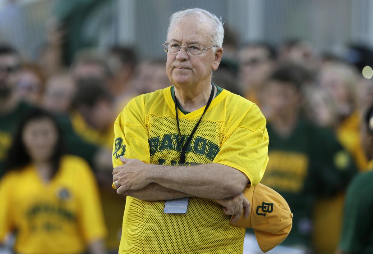 FILE - In the Sept. 12, 2015, file photo, Baylor President Ken Starr waits to run onto the field before an NCAA college football game in Waco, Texas. The NCAA infractions committee said Wednesday, Aug. 11, 2021, that its years-long investigation into the Baylor sexual assault scandal would result in four years probation and other sanctions, though the “unacceptable” behavior at the heart of the case did not violate NCAA rules. The NCAA ruling came more than five years after the scandal broke at the world’s largest Baptist university, leading to the firing of successful football coach Art Briles, and the later departures of athletic director Ian McCaw and school president Ken Starr. (AP Photo/LM Otero, File)