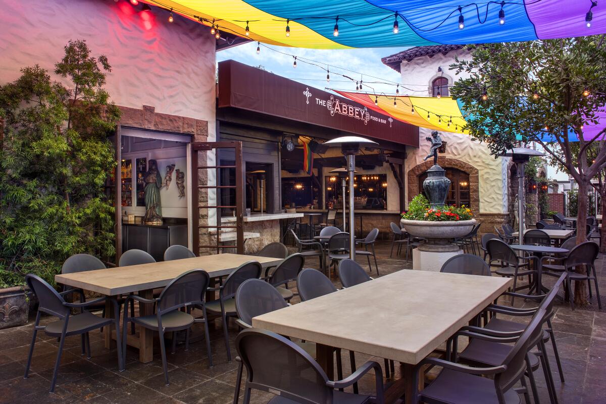 The outdoor patio at the Abbey Food & Bar decorated for Pride.
