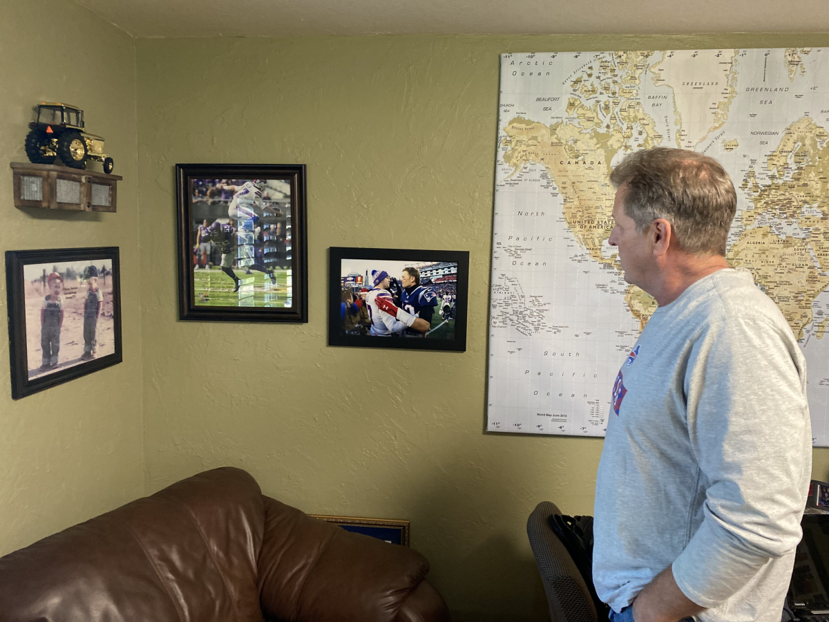 Todd Allen, uncle of Buffalo Bills quarterback Josh Allen, looks at photos of his nephew.