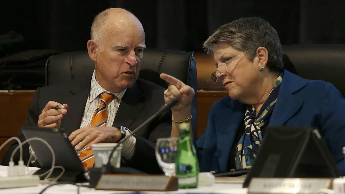 Gov. Jerry Brown talks with University of California president Janet Napolitano during a UC Board of Regents meeting in San Francisco on March 18, 2015.