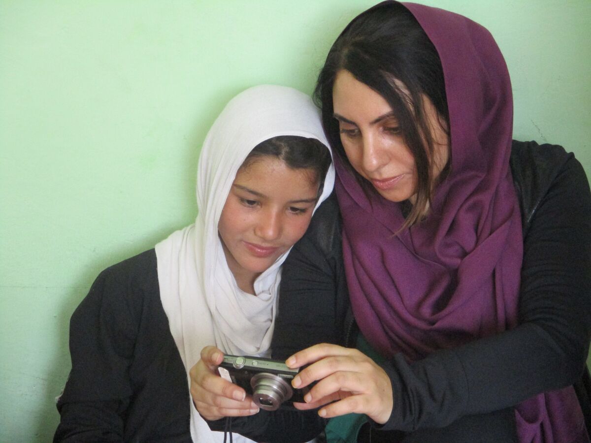 Aria Raofi and her photography student before the bombing in Kabul, Afghanistan.