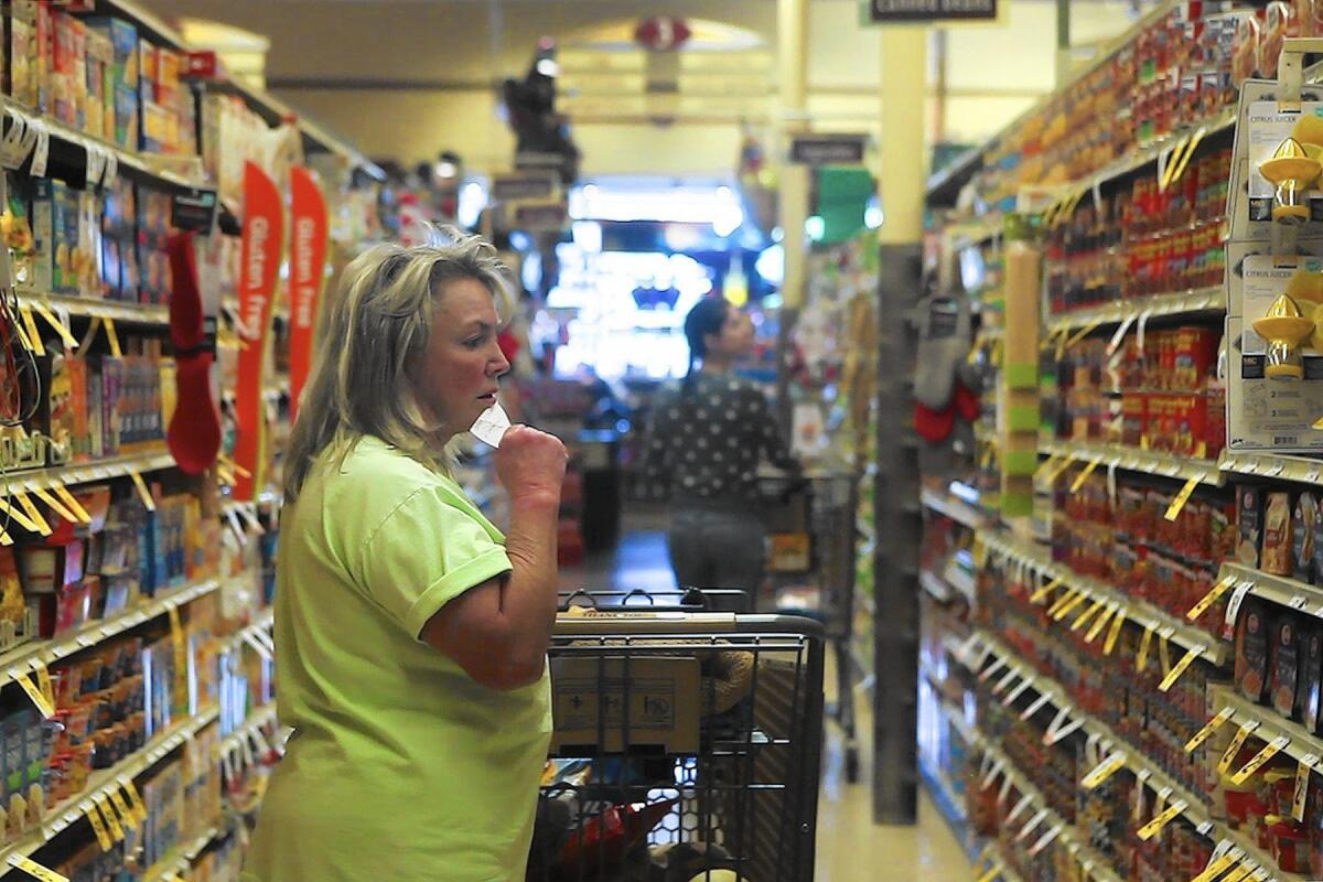 Margie Myers, a resident of Alhambra for 64 years, shops for groceries at a Pavilions store in South Pasadena. She previously shopped at a Ralphs in Alhambra until it was replaced by a 99 Ranch store.