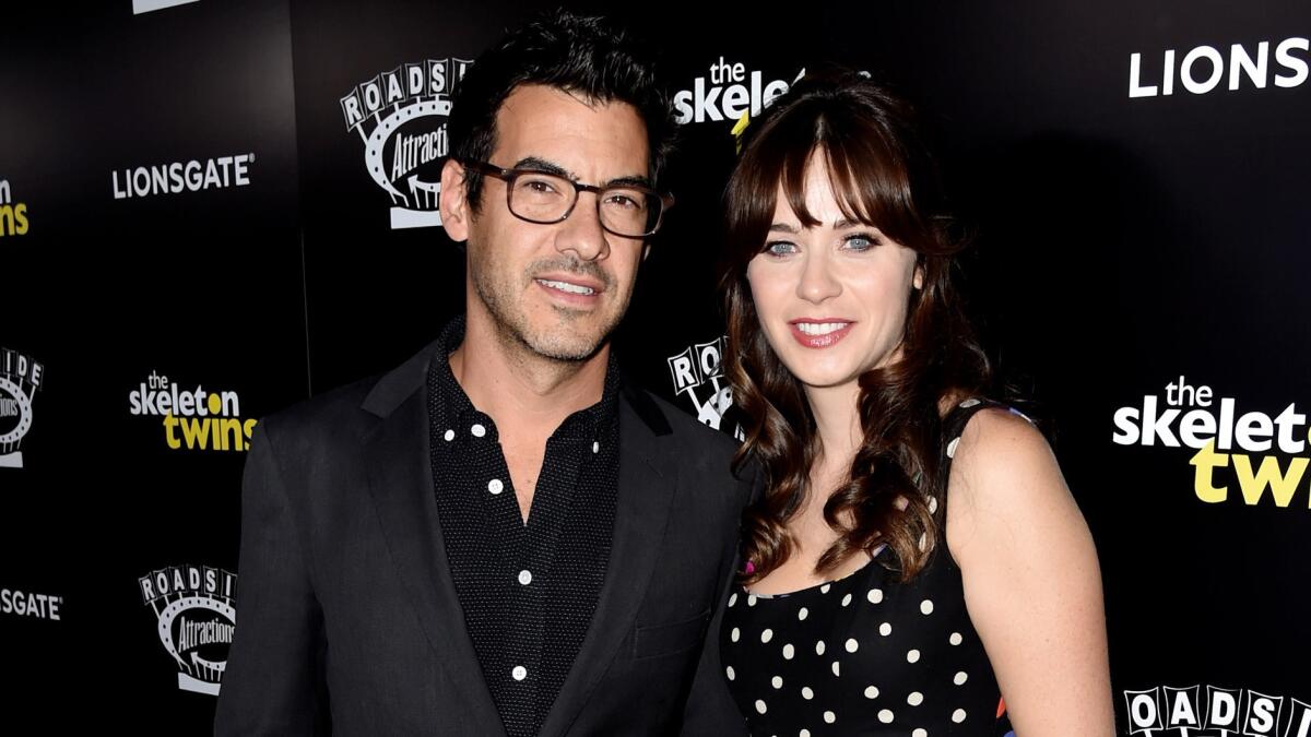 Zooey Deschanel and Jacob Pechenik arrive at the premiere of "The Skeleton Twins" at the Arclight Theatre in Los Angeles on Sept. 10.