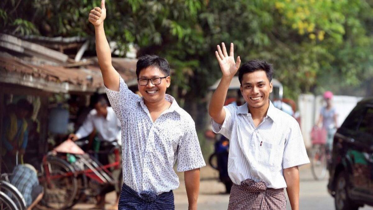 Reuters journalists Wa Lone, left, and Kyaw Soe Oo walk out of Insein prison May 7 in Yangon, Myanmar.