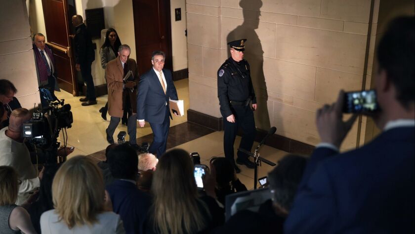 Michael Cohen leaves a House Intelligence Committee hearing in Washington on Feb. 28.