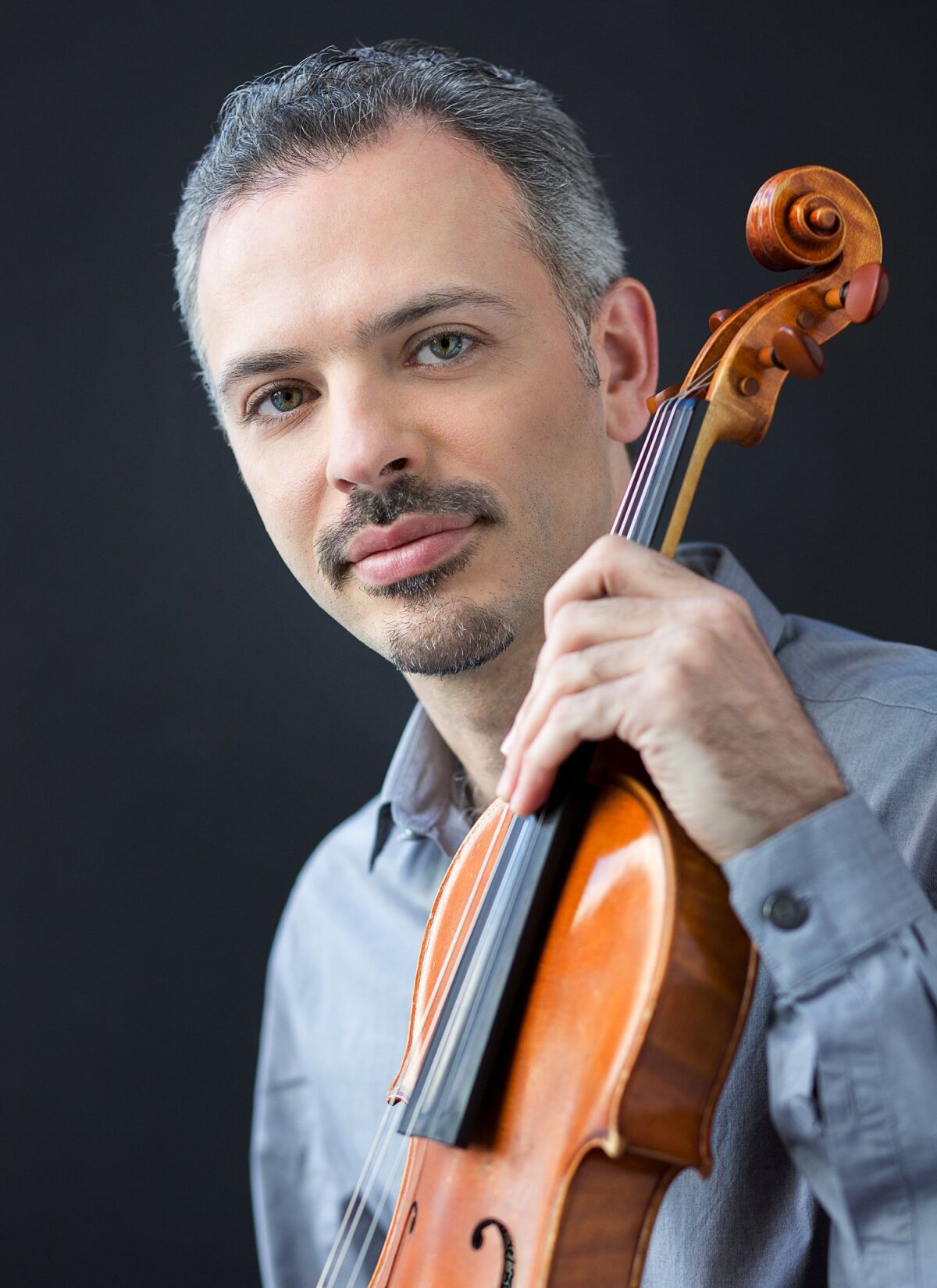 Violinist Colin Jacobsen with his violin