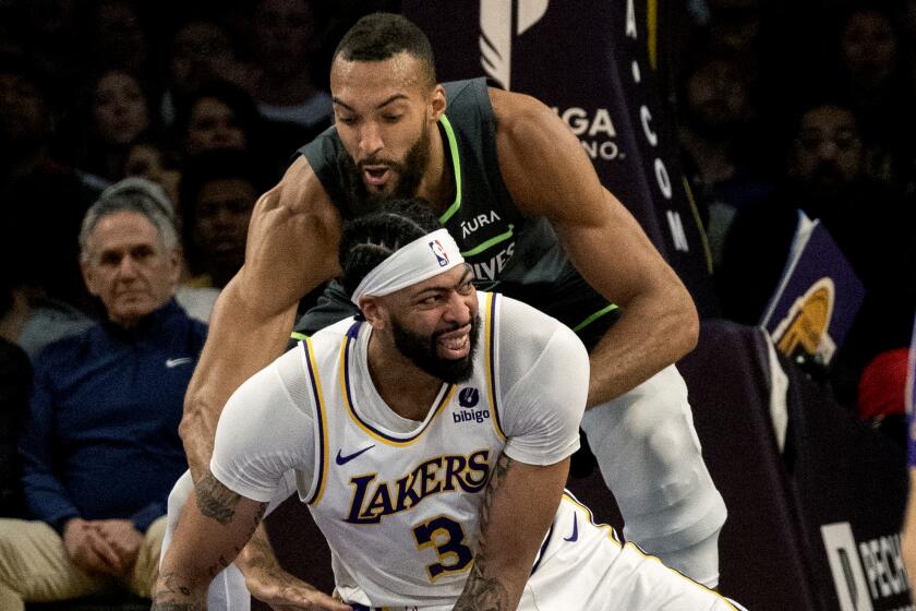 LOS ANGELES, CA - APRIL 7, 2024: Los Angeles Lakers forward Anthony Davis (3) loses his balance.