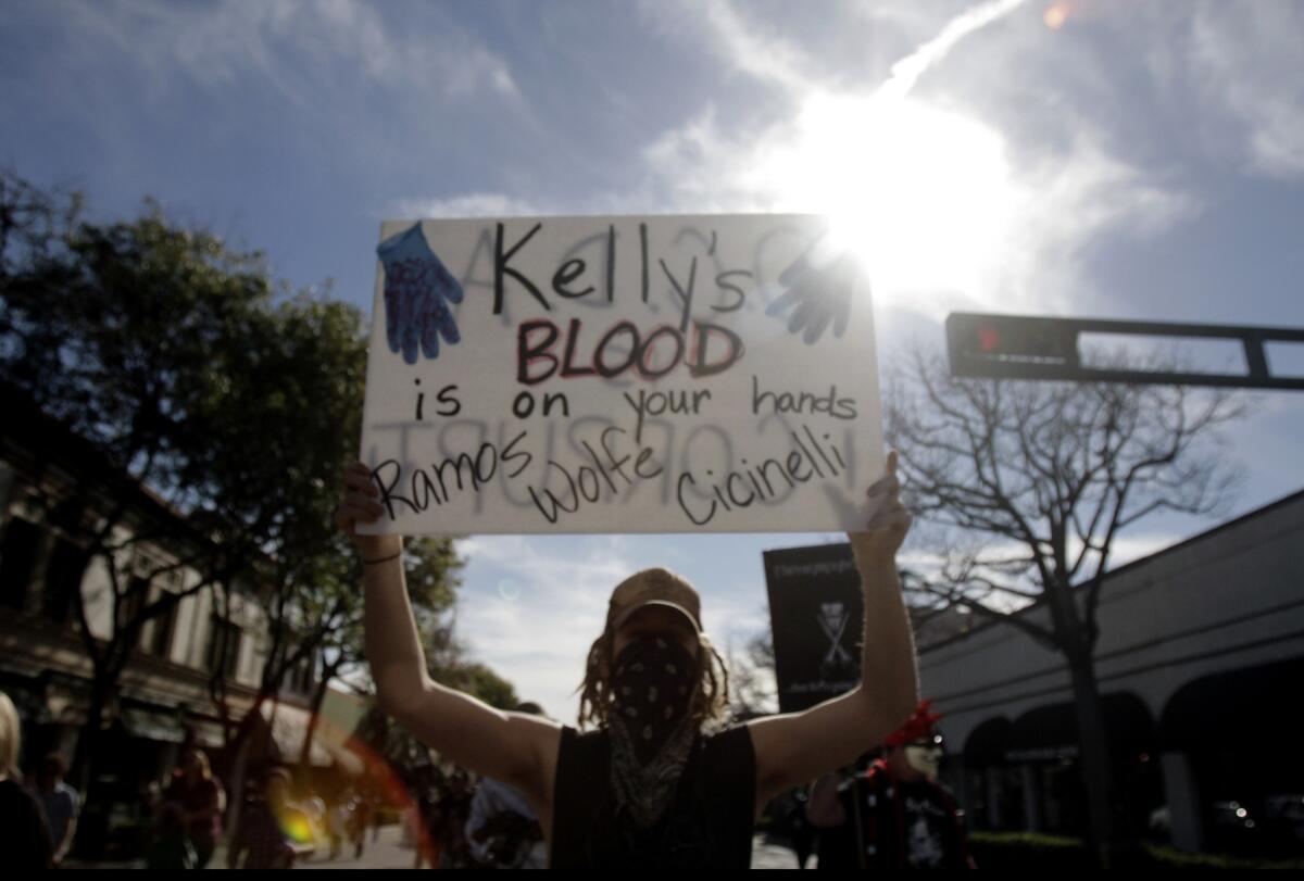 Protesters march along Harbor Boulevard in Fullerton after Monday's verdict in the case against two police officers in the beating death of Kelly Thomas.