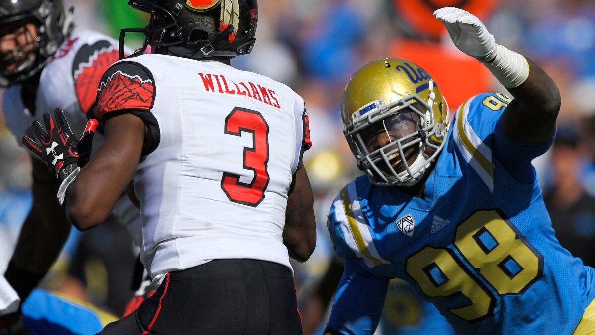 UCLA's Takkarist McKinley move in to sack Utah quarterback Troy Williams on Oct. 22.