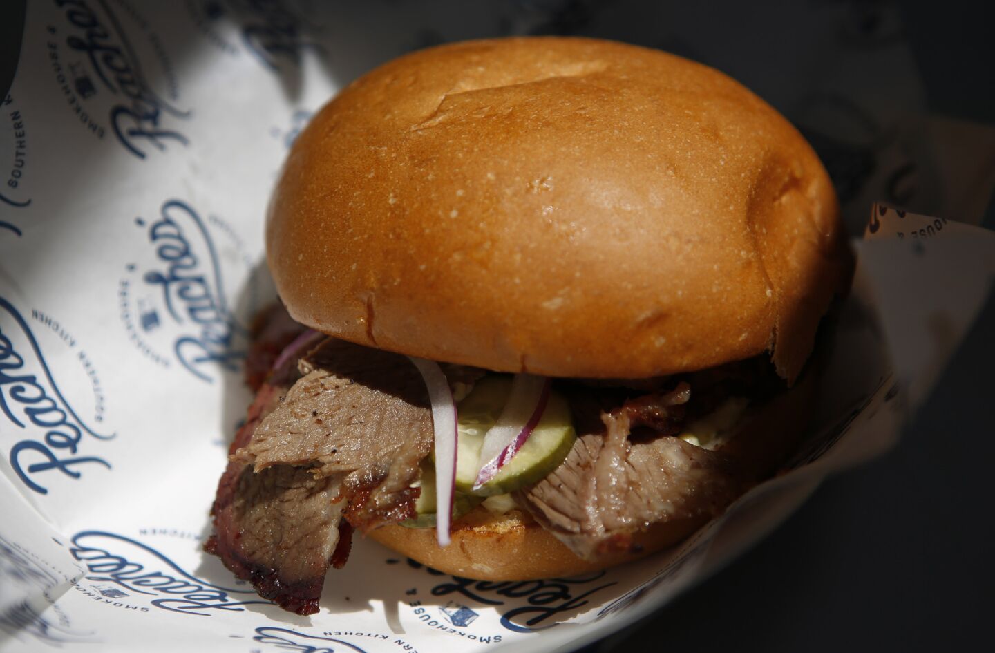 The brisket sandwich at Peaches', a food truck specializing in Southern food.