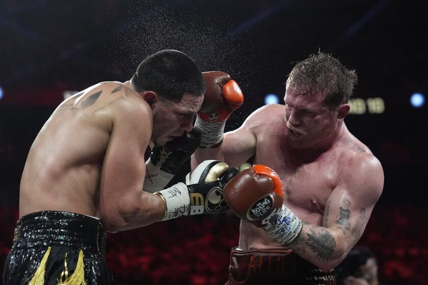 Canelo Alvarez hits Edgar Berlanga in a super middleweight title bout Saturday, Sept. 14, 2024, in Las Vegas. (AP Photo/John Locher)