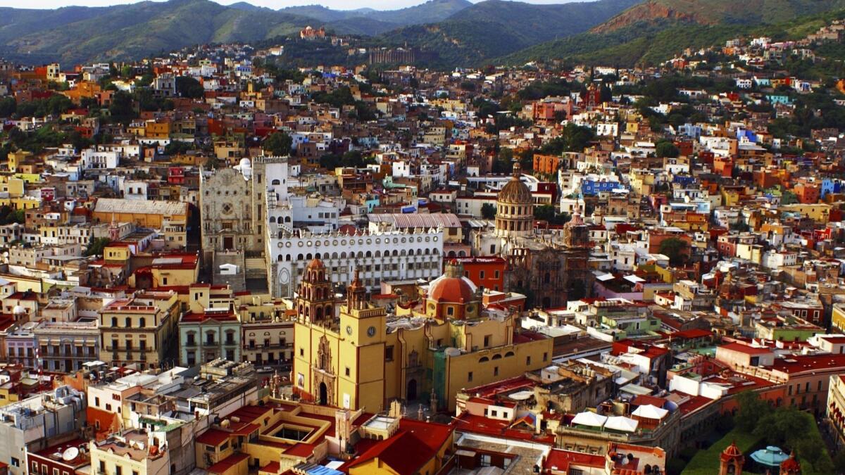 You can fly into Guanajuato/Leon (that airport is about midway between the two cities in Mexico) for $265 on AeroMexico.