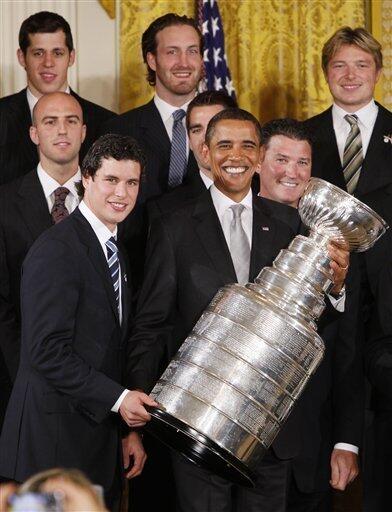 NHL's Stanley Cup rests on a table in front of a portrait of Martha  Washington, wife of first president George Washington, just prior to U.S.  President Barack Obama honoring the players and