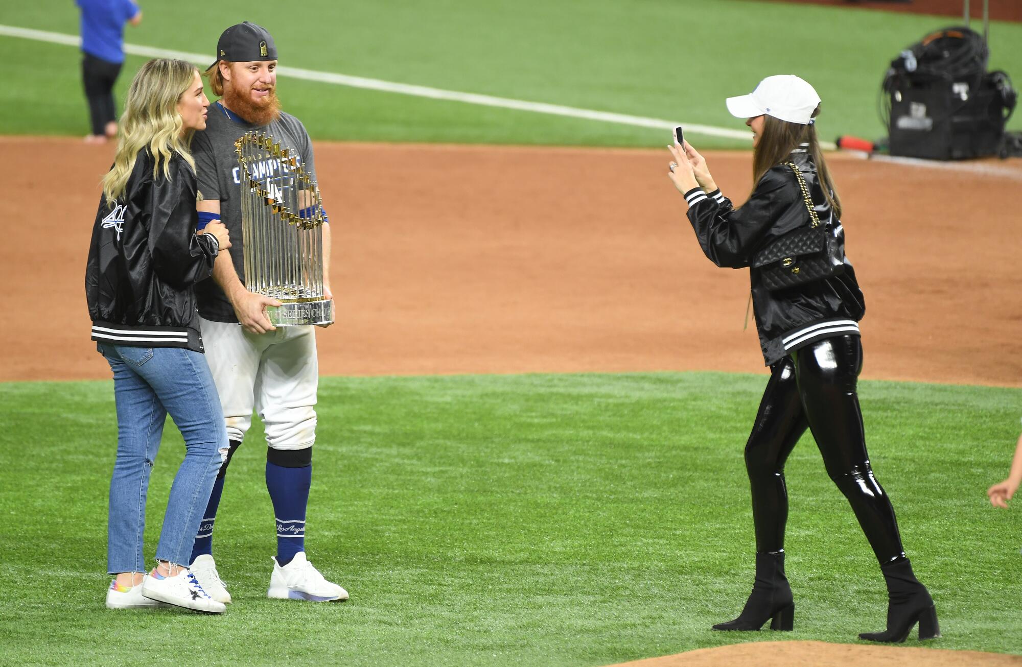 Dodgers third baseman Justin Turner poses for a photo while standing next to his wife, Kourtney Pogue.