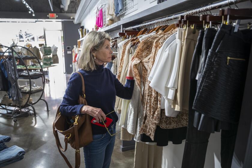 Pam Nestande shops at Hemline Austin on March 10, the day that Texas lifted its COVID-19 mask mandate.