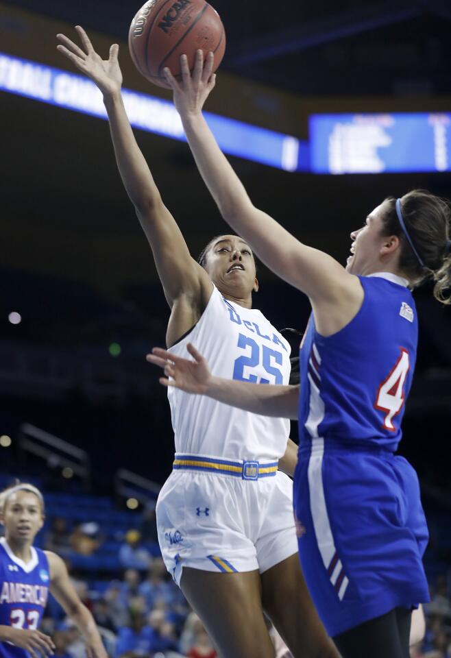 American guard Emily Kinneston (4) goes to the basket against UCLA forward Monique Billings (25) in the first half Saturday at Pauley Pavilion.