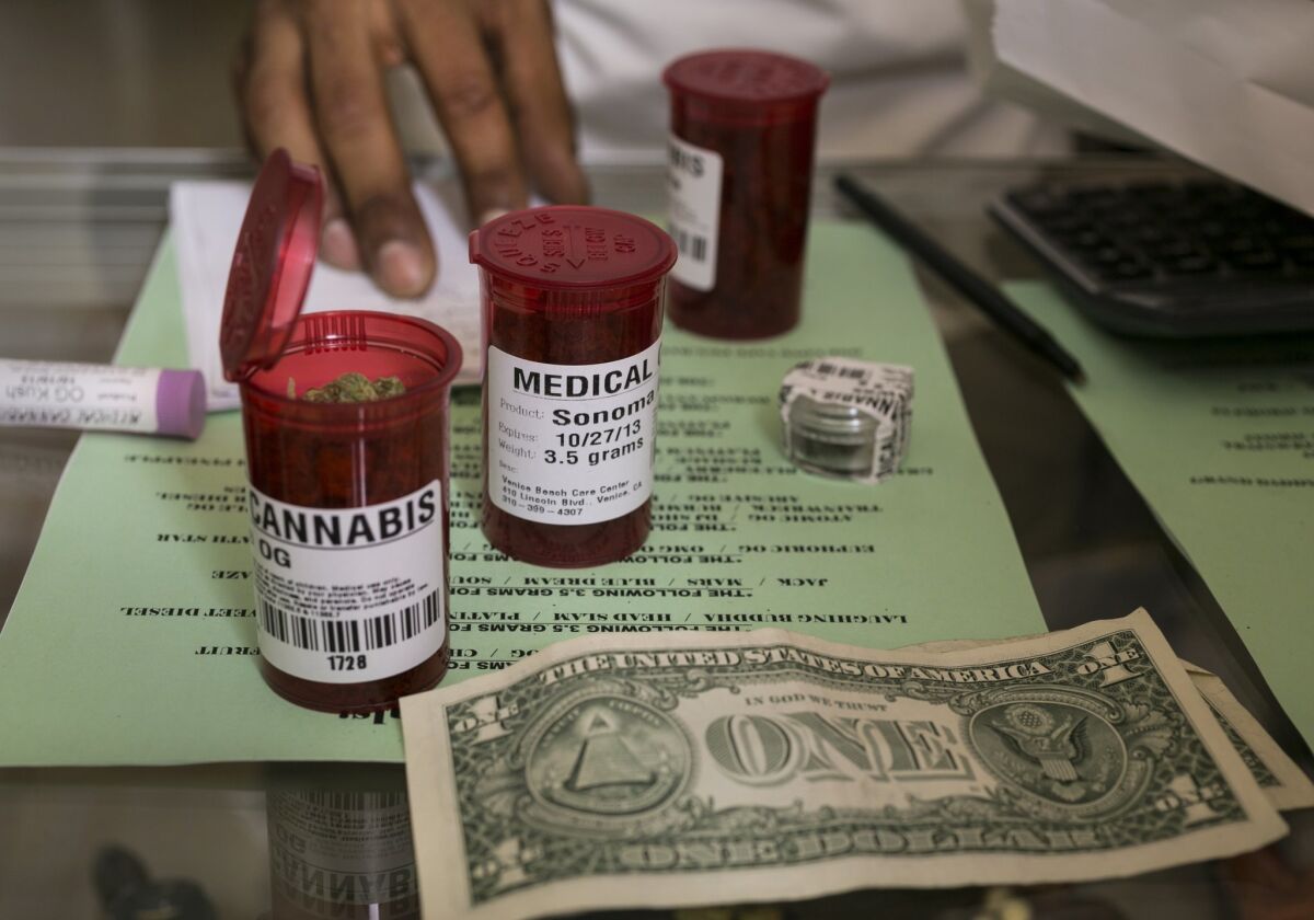 Medical marijuana prescription vials are filled at a pot dispensary in Venice.