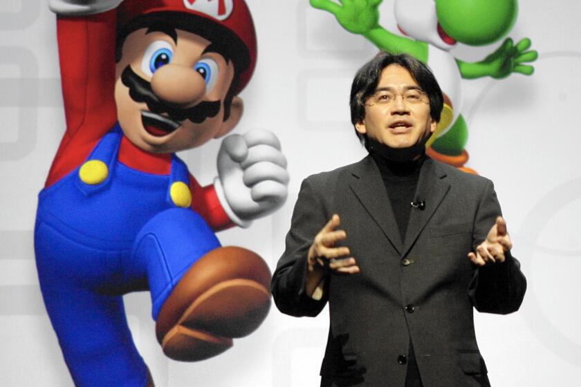 In this July 15, 2008, photo, Satoru Iwata spoke about Nintendo's enhanced Wii remote controller and new games.