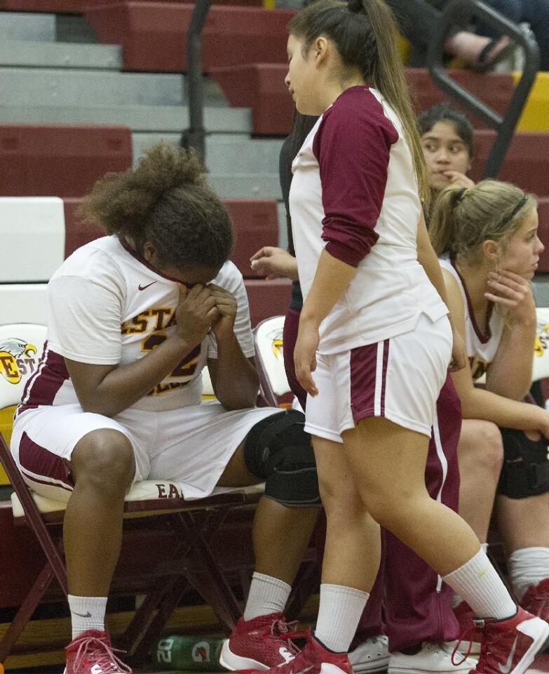 Estancia High's Maya Van Den Heever, left, reacts after fouling out during the fourth period against Laguna Beach.