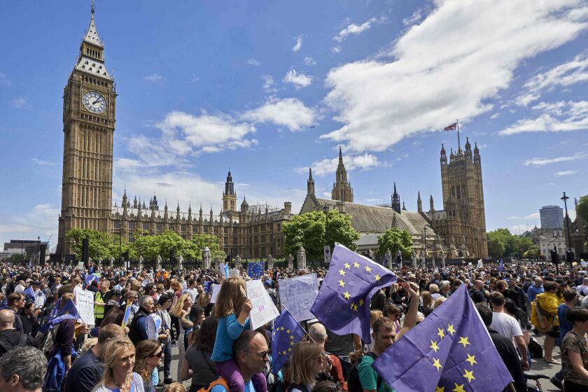Pro-Europe demonstrators rally in front of the Houses of Parliament in London on Saturday.