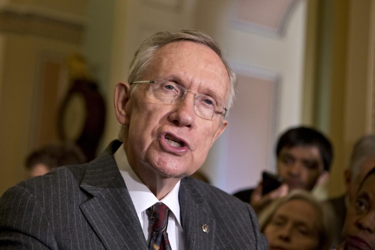 Senate Majority Leader Harry Reid (D-Nev.) speaks with reporters following a Democratic strategy session at the Capitol in Washington, D.C. Reid said he plans showdown vote on gun control on Thursday.