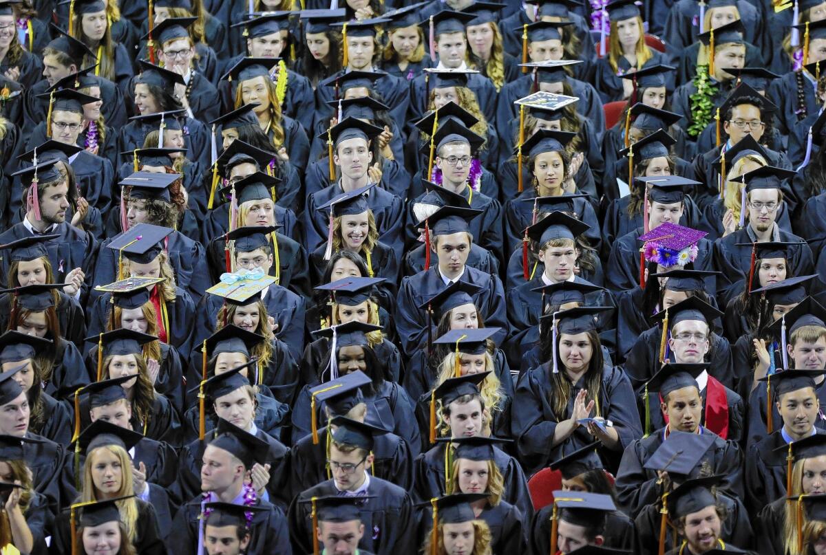 Median earnings for recent college graduates rose only 6% between 2006 and 2013. Above, Seattle Pacific University grads in June.