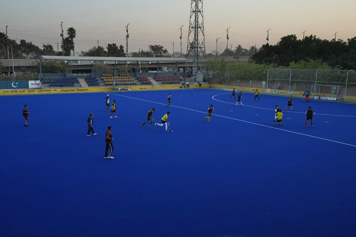 Field hockey players of a local club attend a training session, in Karachi, Pakistan, Sunday, Nov. 13, 2022. There is only one sport that matters in Pakistan and that's cricket, a massive money-making machine. But minors sports like rugby are struggling to get off the ground due to lack of investment and interest, stunting their growth at home and chances of success overseas. Even previously popular sports like squash and field hockey, which Pakistan dominated for decades, can't find their form.(AP Photo/Fareed Khan)