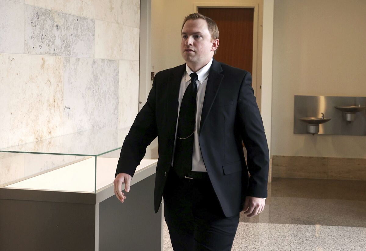 FILE - Aaron Dean, who is charged in the murder of Atatiana Jefferson, walks into the courtroom following a break in the third day of a pre-trial hearing Monday, April 4, 2022 in Fort Worth, Texas. Dean, a former Forth Worth police officer will face a murder trial in the city where he fatally shot a Black woman through a window of her home in 2019, a state judge ruled Wednesday, May 4, 2022. (Yffy Yossifor/Star-Telegram via AP, File)