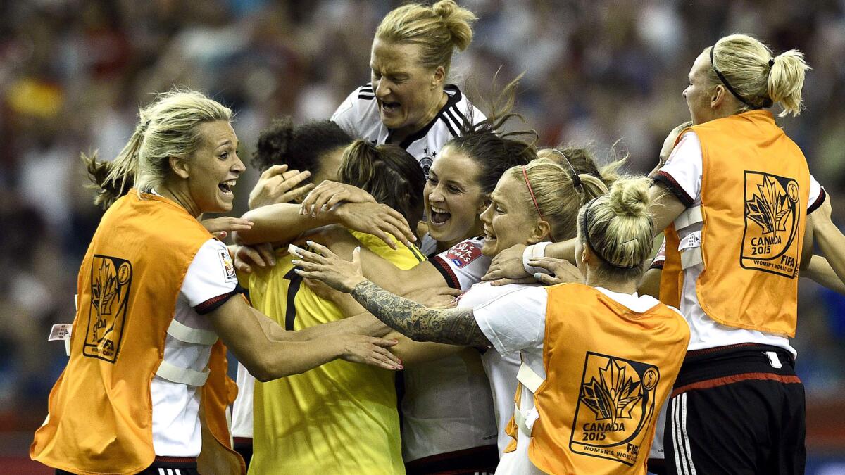 Germany players celebrate after defeating France in a penalty-kick shootout in a quarterfinal of the Women's World Cup on Friday in Montreal.