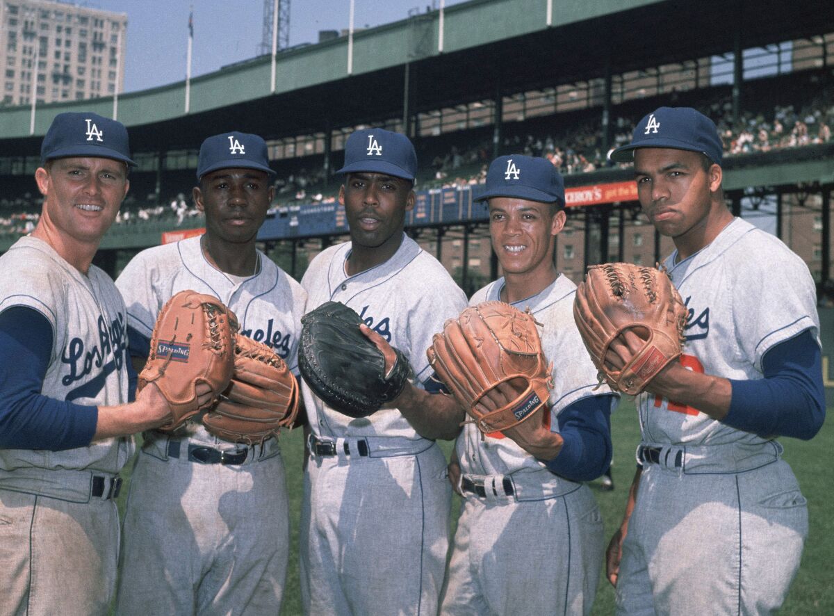 Ron Fairly, Jim Gilliam, John Roseboro, Maury Wills and Tommy Davis wear Dodgers uniforms in a vintage photo.