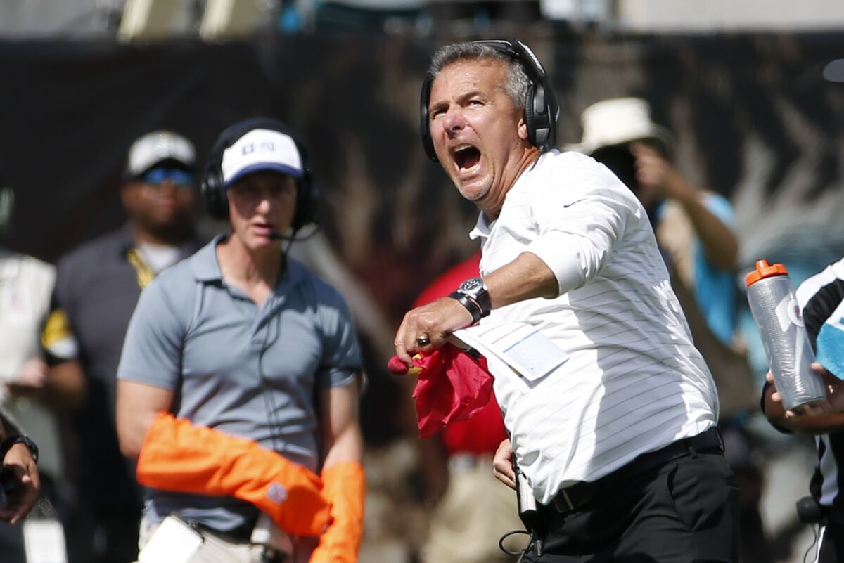 Jacksonville Jaguars head coach Urban Meyer reacts to a play as he watches a video replay of a call he disputed during the second half of an NFL football game, Sunday, Oct. 10, 2021, in Jacksonville, Fla. (AP Photo/Stephen B. Morton)