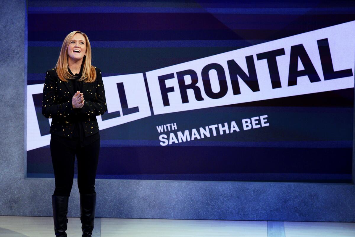 Samantha Bee in front of a title card for "Full Frontal With Samantha Bee"