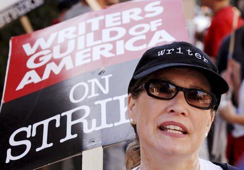 Writer Katherine Fugate joins picketers outside Warner Bros. Studios in Burbank.