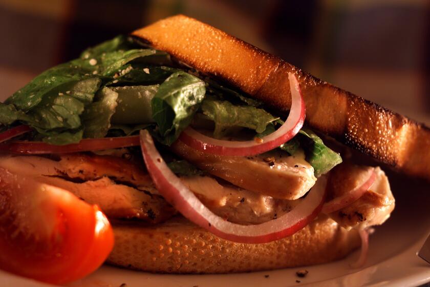 Caesar salad sandwiches with chicken.
