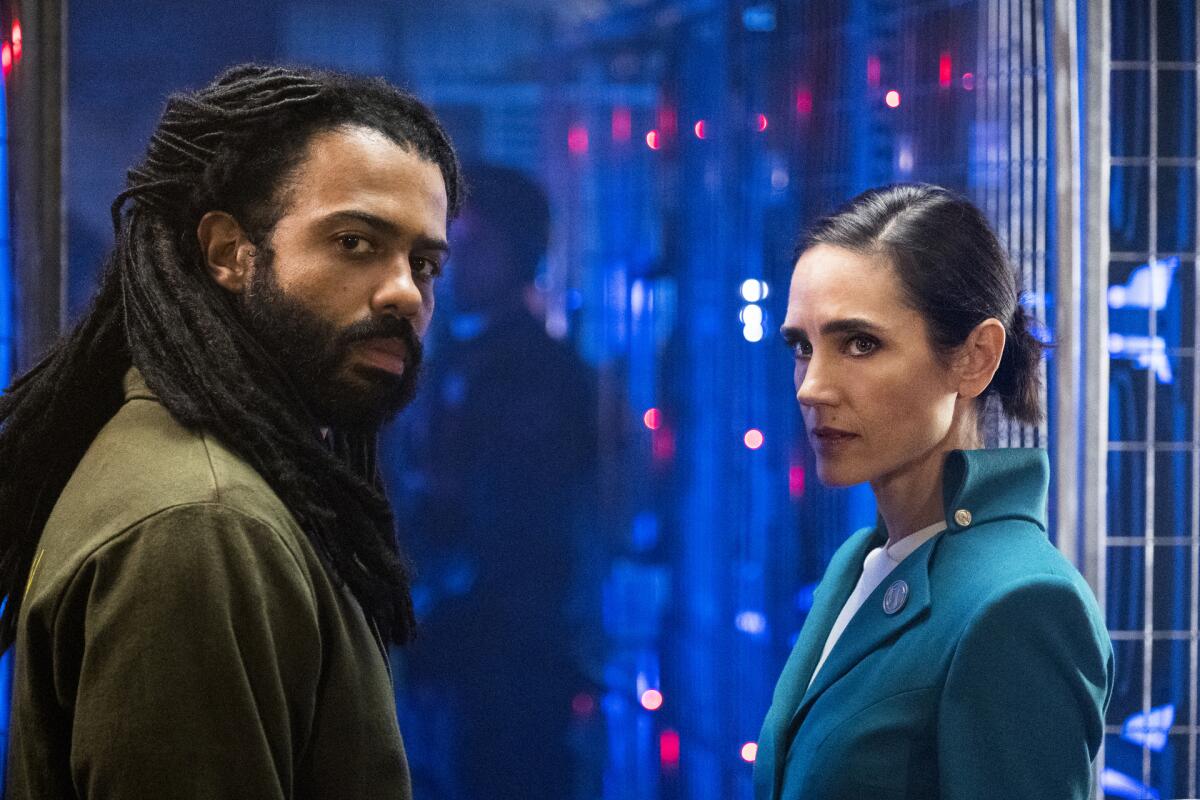 Daveed Diggs and Jennifer Connelly represent opposite ends of the train in TNT's "Snowpiercer." on TNT.