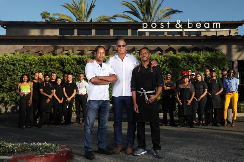 BALDWIN HILLS-CA-JULY 19, 2019: Restauranteur Brad Johnson (C), chef-owner John Cleveland (R) and chef-consultant Govind Armstrong (L) are photographed with staff at Post & Beam restaurant in Baldwin Hills on Thursday, July 19, 2019. (Christina House / Los Angeles Times)