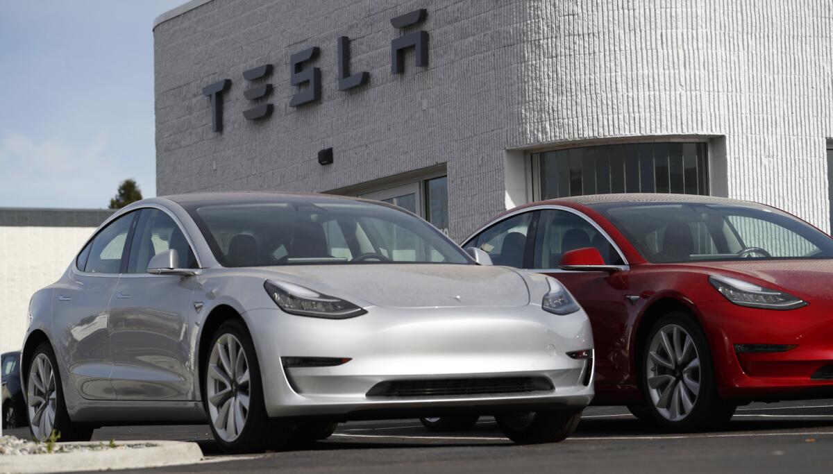 Model 3 cars at a Tesla dealership in Colorado.