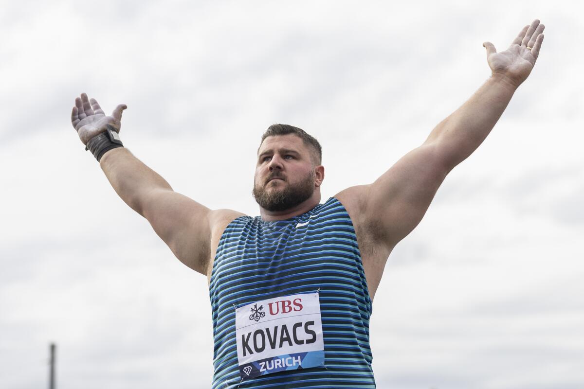Joe Kovacs of the United States reacts as he participates in the Shot Put Men during the city event of the Weltklasse IAAF Diamond League international athletics meeting at Sechselaeutenplatz in front of the Opera House in Zurich, Switzerland, Wednesday, Sept. 7, 2022. (Michael Buholzer/Keystone via AP)