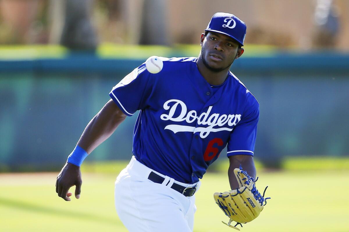 Dodgers outfielder Yasiel Puig makes a catch during spring training on Feb. 26.