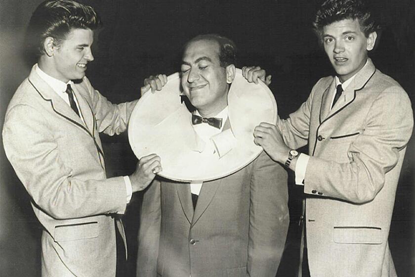 1950s. The Everly Brothers put drum on Art Laboe's head. Laboe, 89, is returning to the airwaves at KDAY-FM (93.5). CR: Art Laboe Archives.