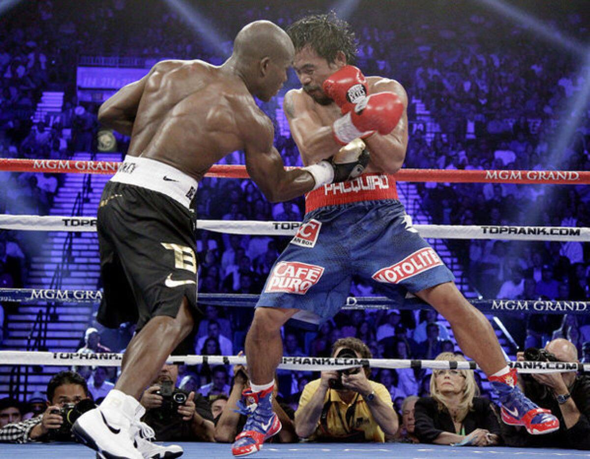Timothy Bradley lands a right to the body of Manny Pacquiao during their bout in 2012.