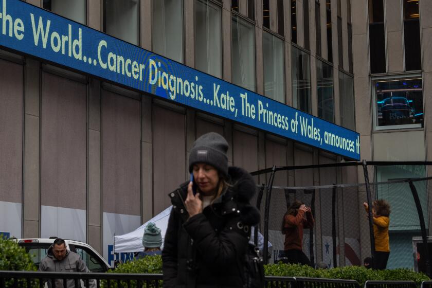 NEW YORK, NEW YORK - MARCH 22: A screen displays the news of the Princess of Wales's cancer diagnosis at the News Corporation building on March 22, 2024 in New York City. Catherine, Princess of Wales, disclosed that she is undergoing chemotherapy for cancer at an early stage, appealing for "time, space, and privacy" as she completes her treatment. (Photo by Adam Gray/Getty Images)