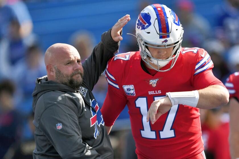 FILE - In this Oct. 20, 2019, file photo, Buffalo Bills offensive coordinator Brian Daboll, left.