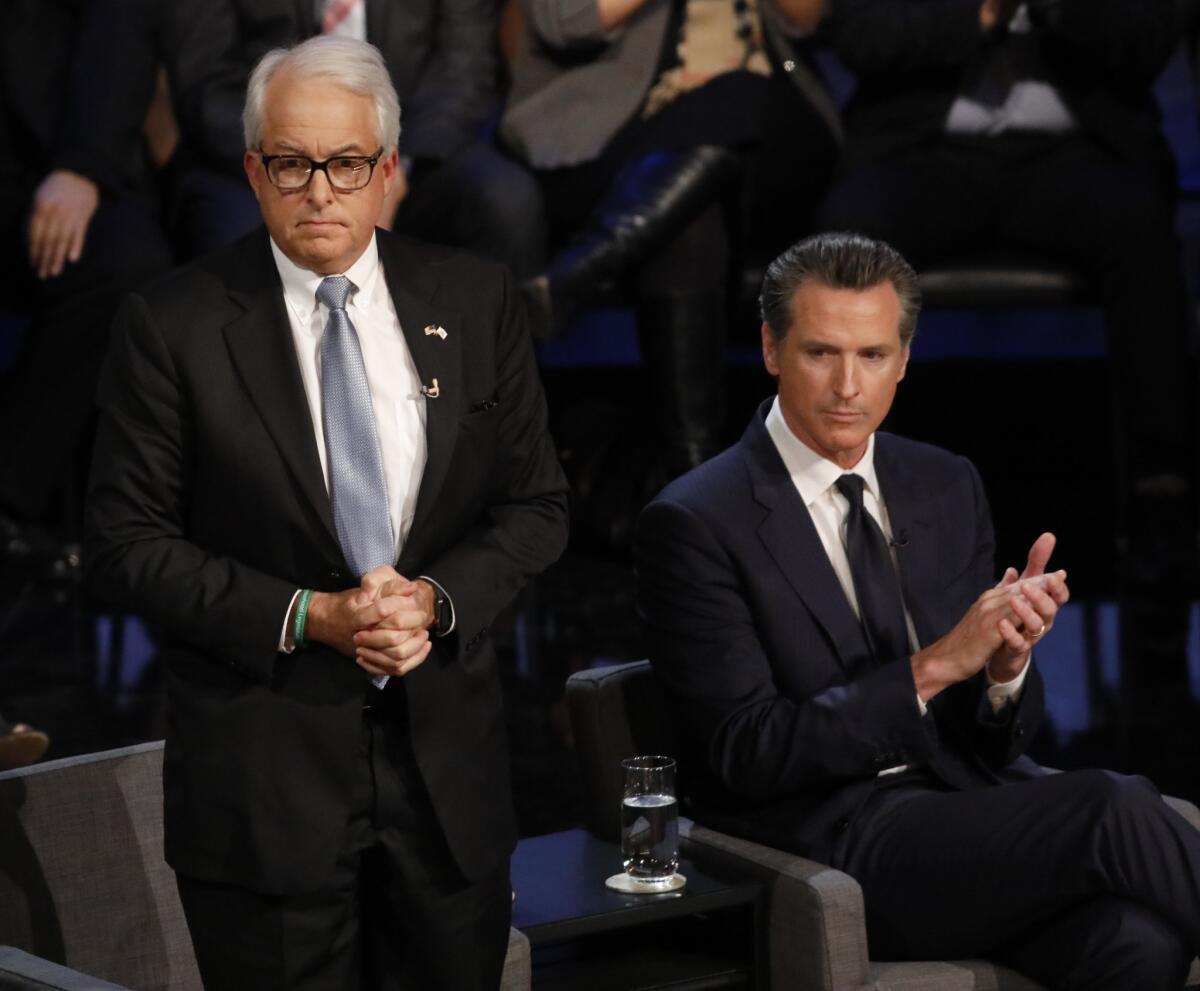 Gubernatorial candidates John Cox, left, and Lt. Gov. Gavin Newsom before a debate at UCLA in January.