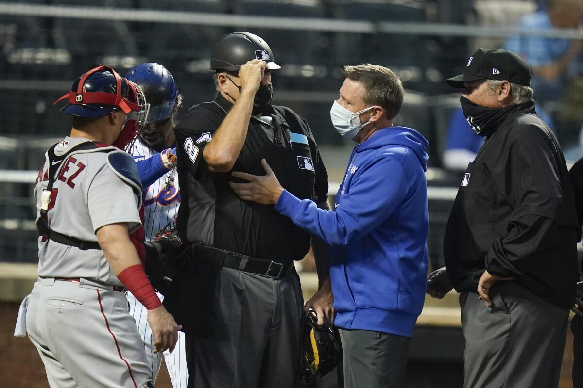 Plate ump Layne hit in mask by foul ball, leaves game - The San Diego  Union-Tribune
