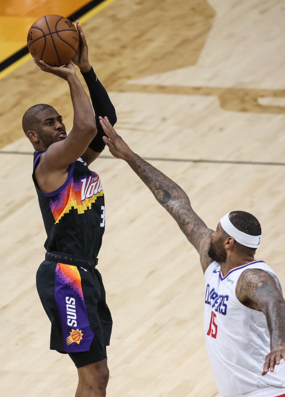 Suns guard Chris Paul shoots over Clippers center DeMarcus Cousins during Game 5.