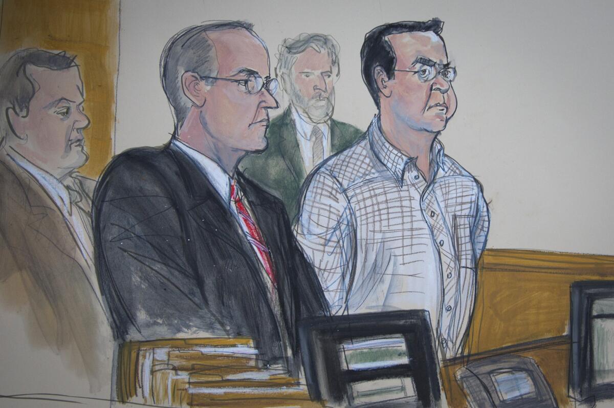 In this courtroom sketch, Rafael Callejas, far right, a former president of Honduras, makes a U.S. court appearance on Dec. 15 in New York with his lawyer in the investigation of bribes and kickbacks involving FIFA.