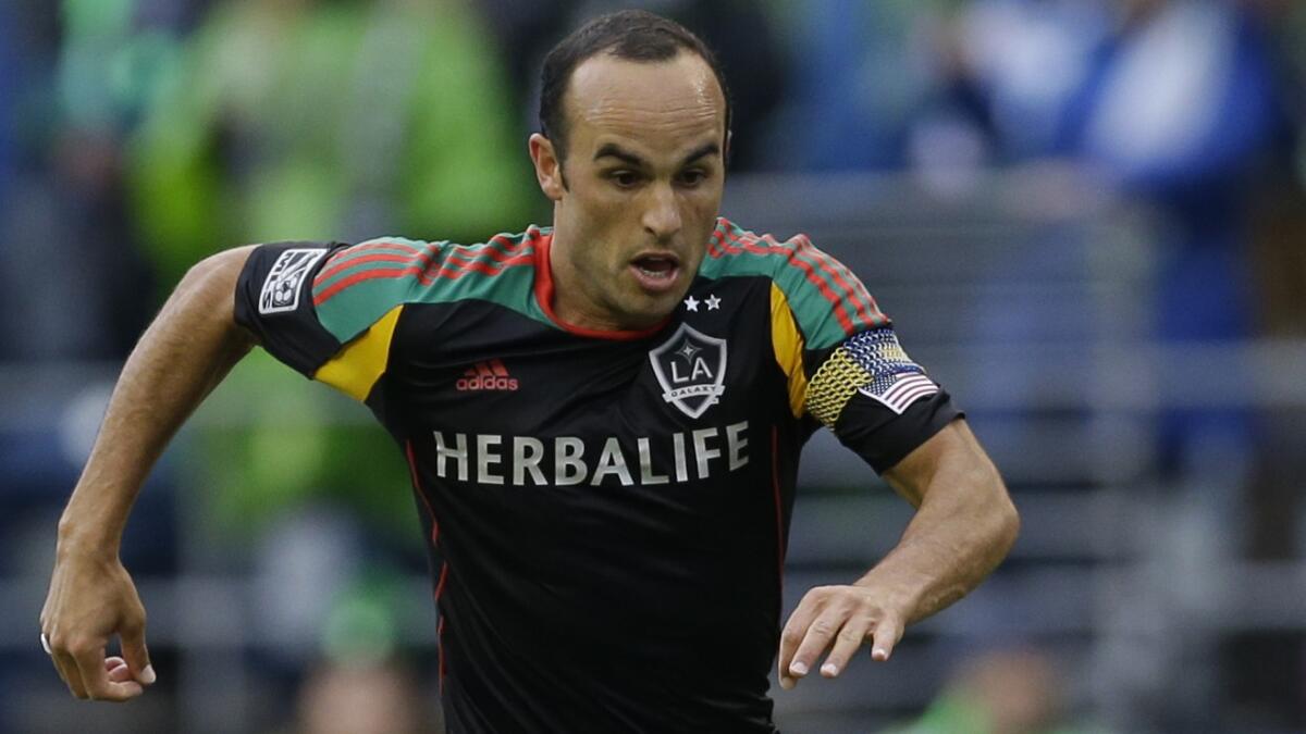 Galaxy forward Landon Donovan runs with the ball during a match against the Seattle Sounders on Oct. 25.