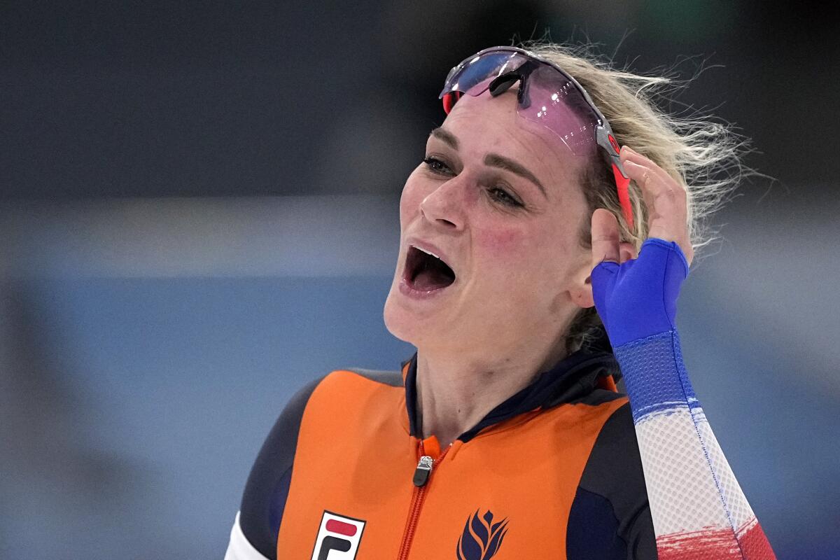 Irene Schouten celebrates her speedskating gold at the 2022 Olympics.